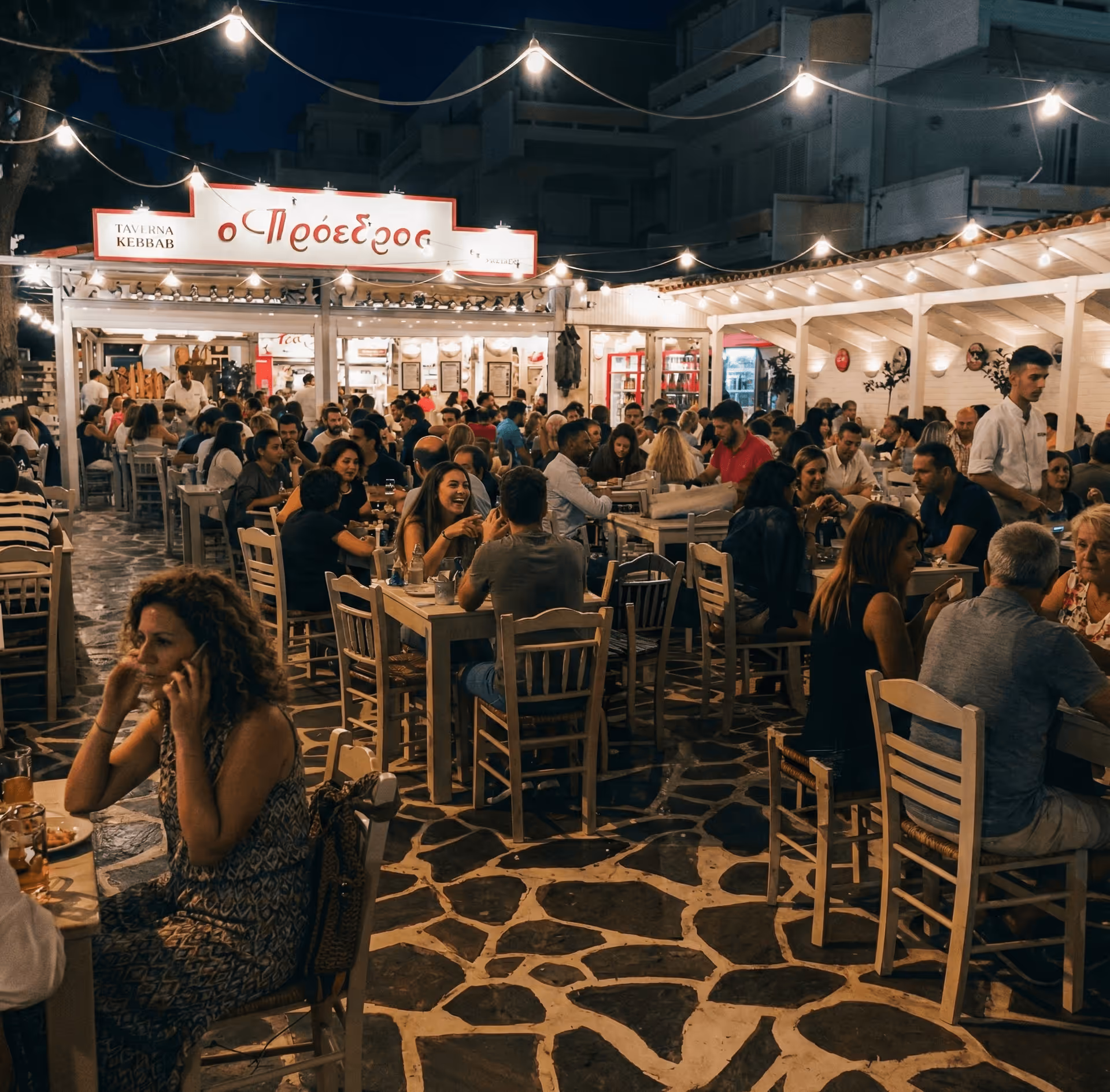 Proedros taverna in Psyrri, Athens — busy outdoor seating under string lights